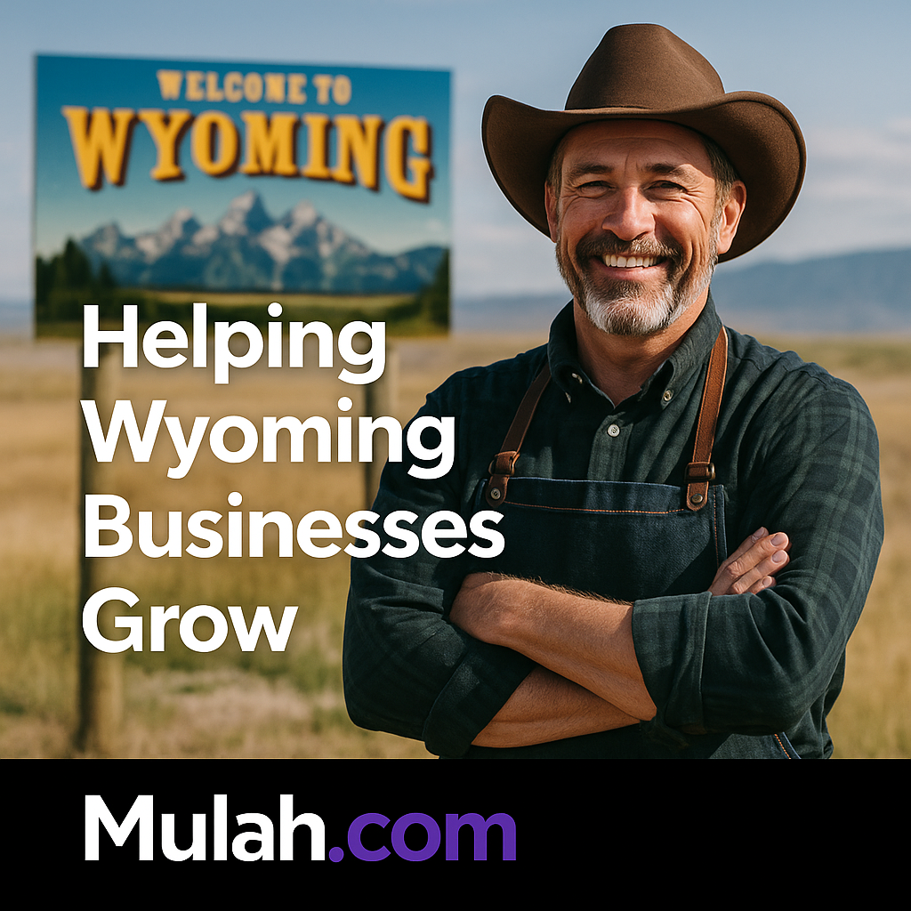 Smiling Wyoming small business owner standing proudly outdoors with text overlay ‘Helping Wyoming Businesses Grow’ and Mulah.com logo.