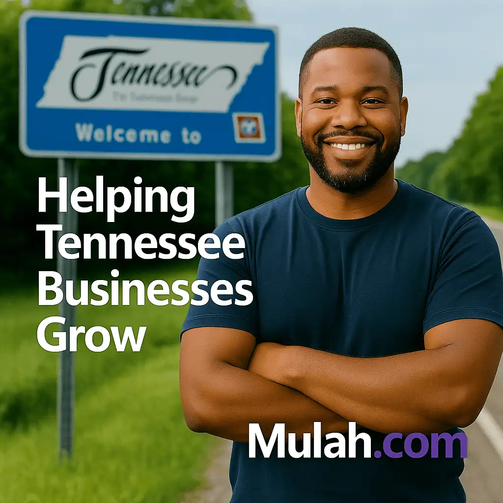 Smiling Tennessee small business owner standing in front of a Welcome to Tennessee sign with text overlay ‘Helping Tennessee Businesses Grow’ and Mulah.com logo.