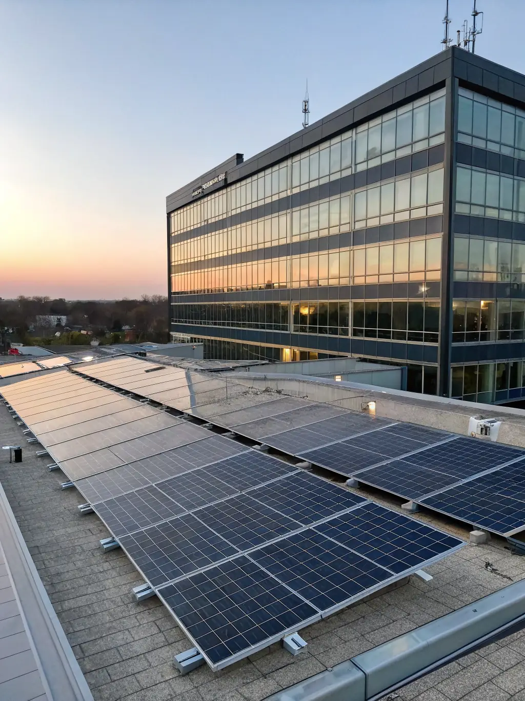 A solar panel installation on a commercial building, highlighting energy conservation and cost savings.
