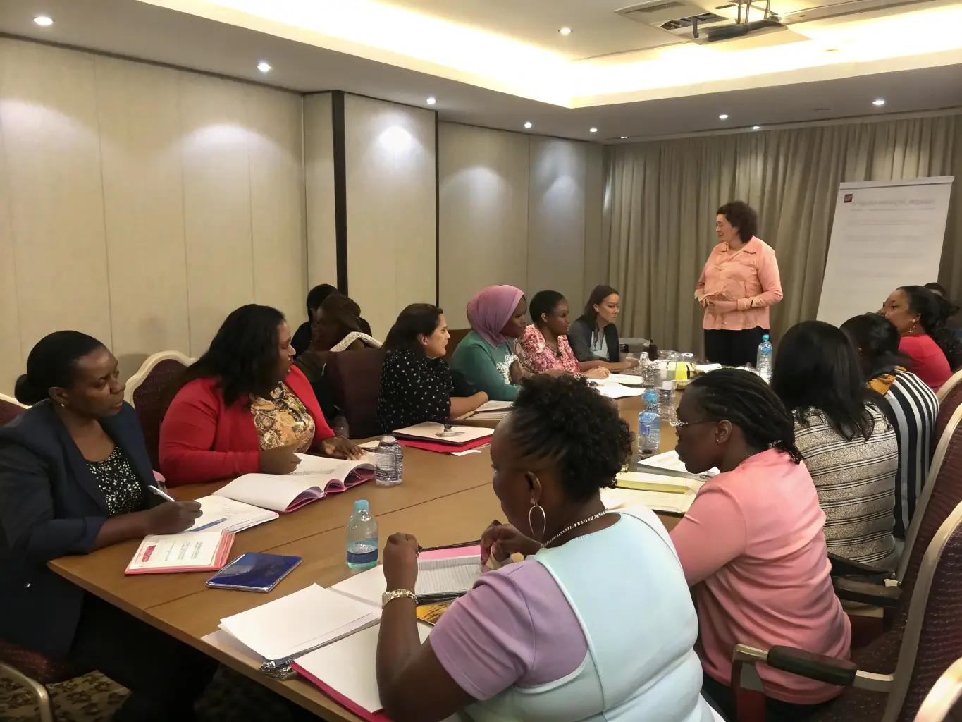 A diverse group of child care professionals attending a workshop or training session, emphasizing Mulah's commitment to supporting the industry's growth and development.