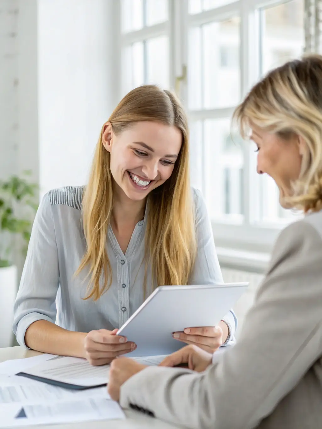 A beauty salon owner reviewing financial documents at her desk, bathed in soft, natural light, symbolizing careful planning and business acumen.