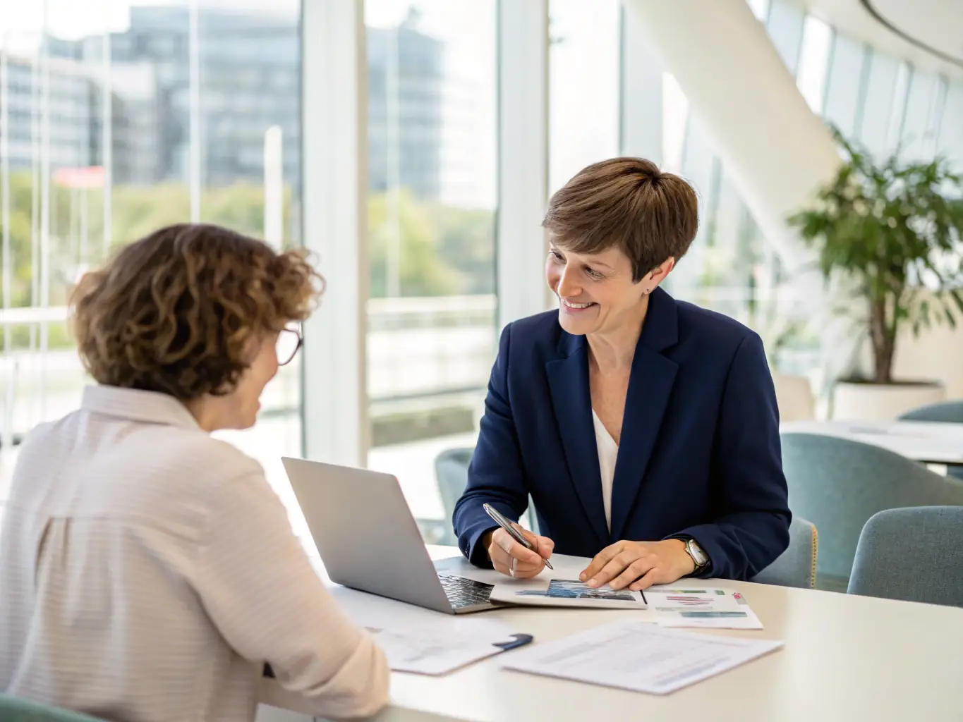 A professional advisor in a modern office setting, discussing financial strategies with a client, emphasizing personalized support and trust.