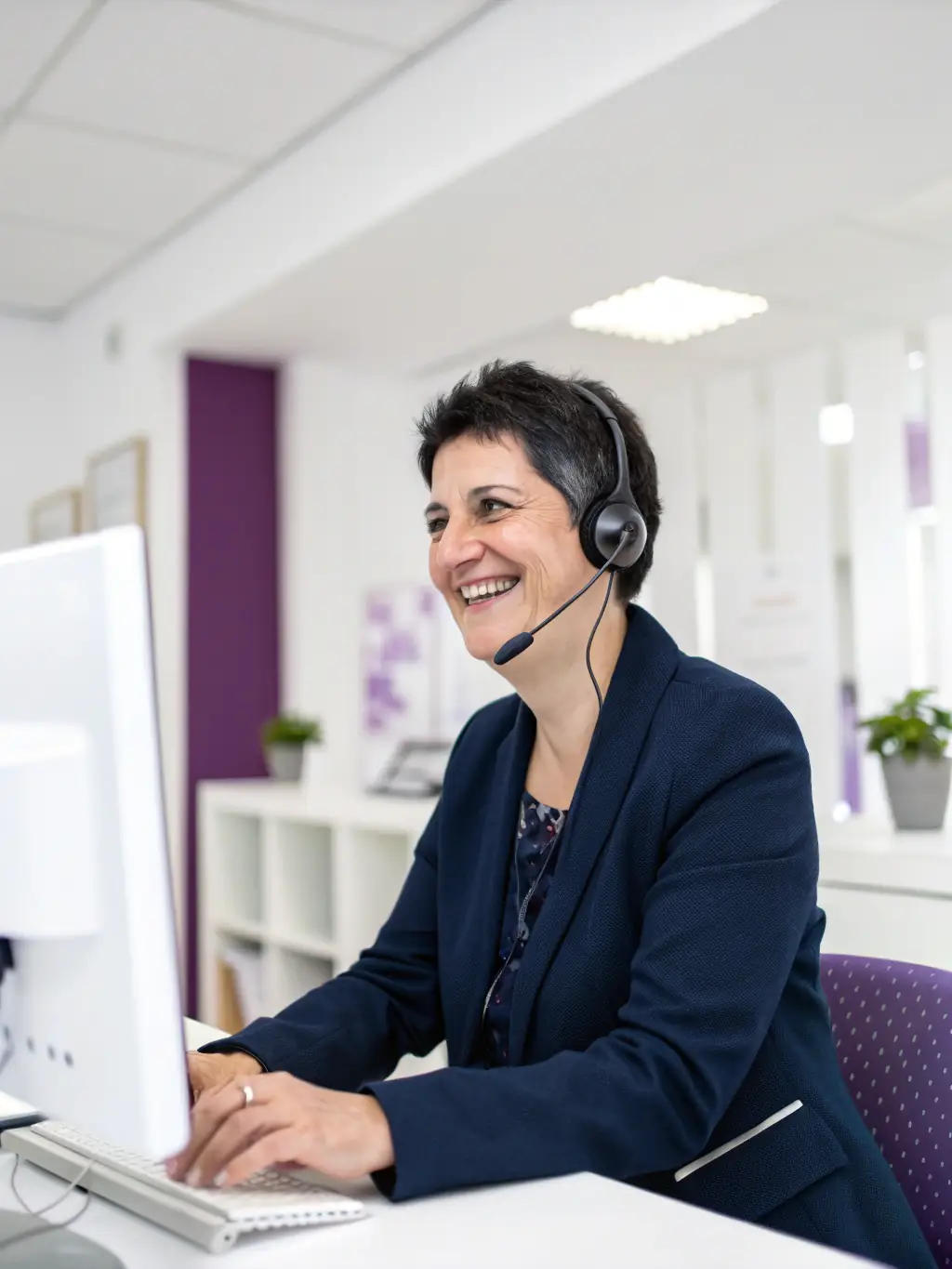 A photograph of a dedicated support team member assisting a pawnshop owner over a video call, highlighting personalized and reliable support.
