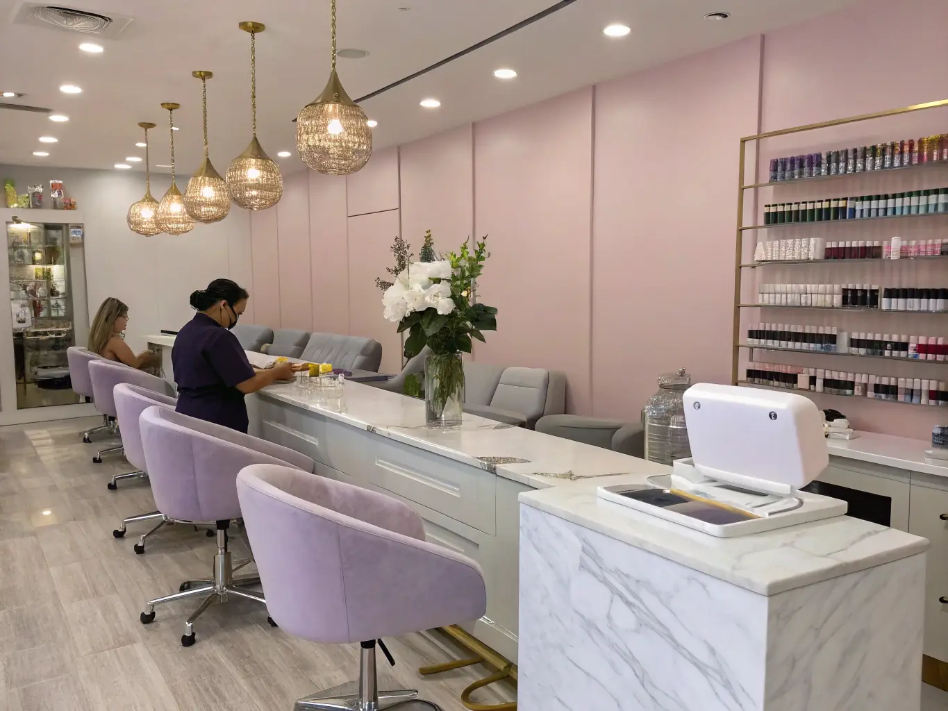 A close-up shot of state-of-the-art nail salon equipment, such as manicure stations, pedicure spas, and sterilization units, highlighting the importance of quality equipment for providing excellent service.