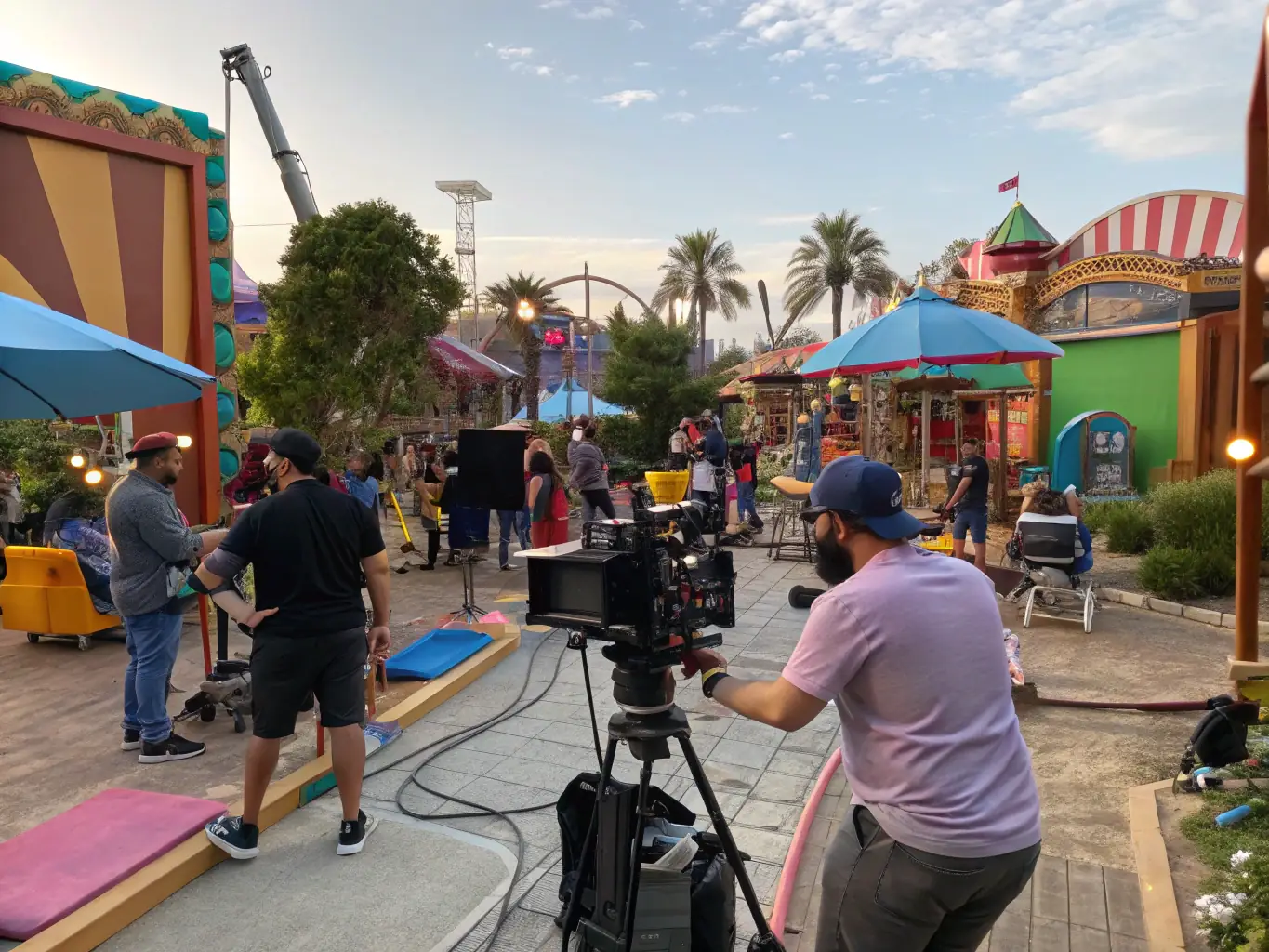 A dynamic image of a film set with cameras rolling and actors performing, representing OnDeckClone's commitment to supporting the creative process and production in the entertainment sector.
