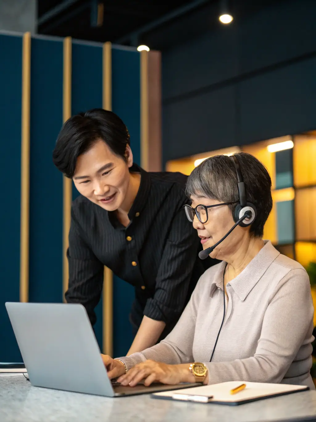 A friendly customer support agent assisting a pawnshop owner via video call, showcasing personalized support.