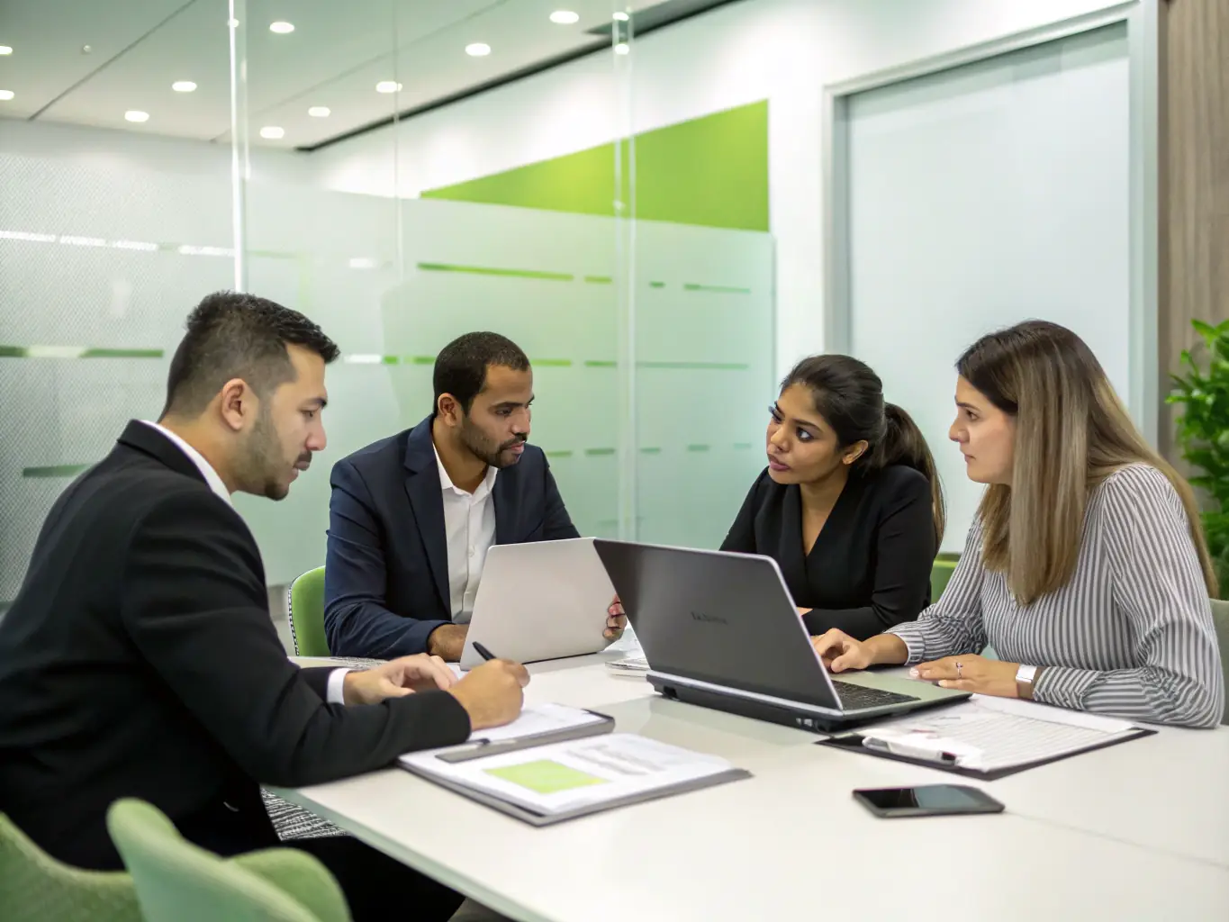A group of diverse pet groomers smiling and collaborating in a modern office setting, reviewing financial documents.