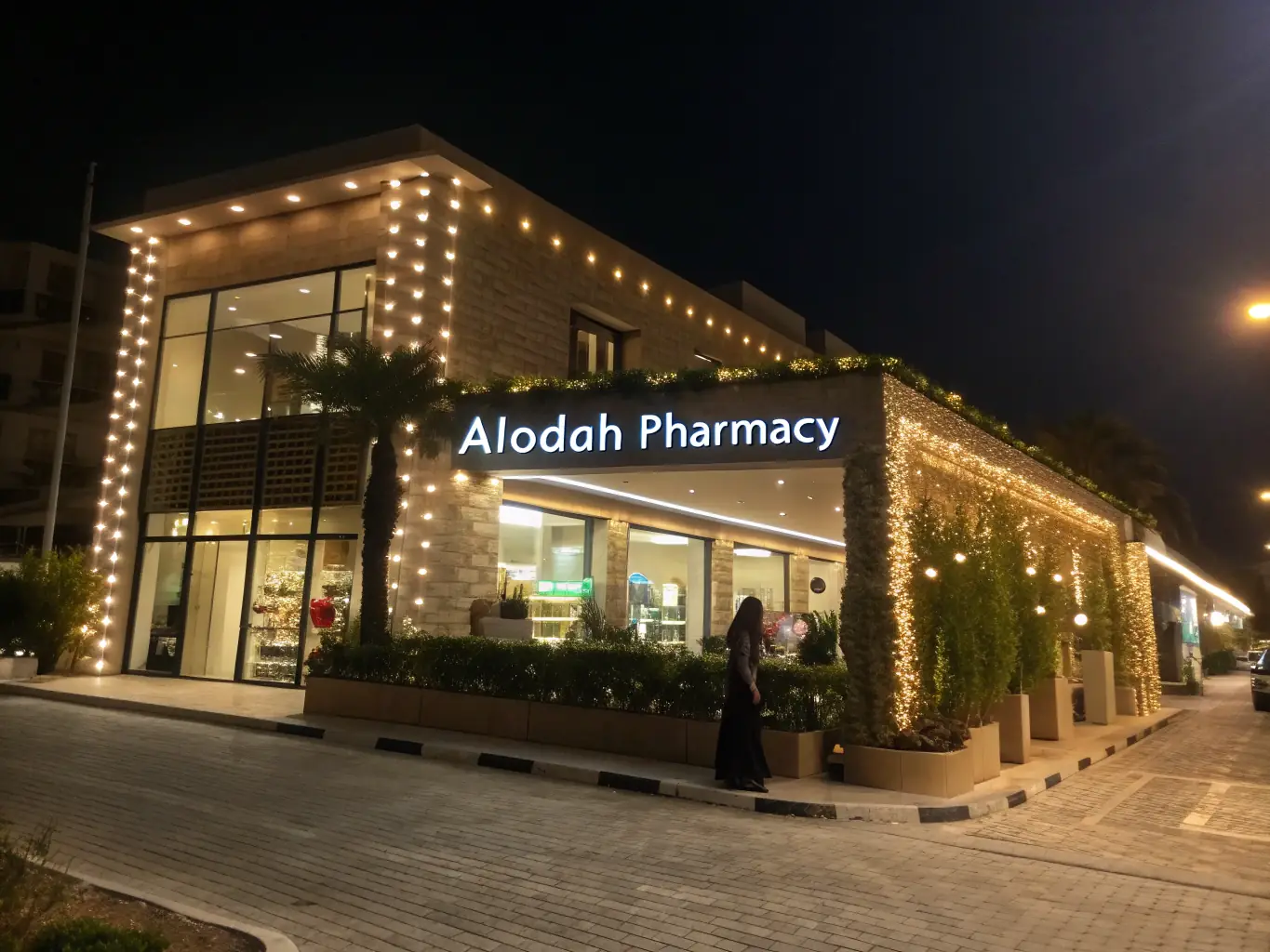 A pharmacy exterior with a visible 'Now Hiring' sign, indicating business growth and expansion, supported by Mulah's funding.