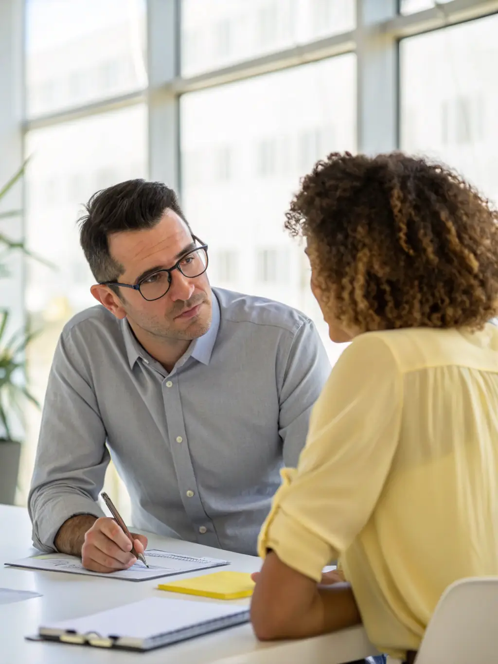 A tobacco shop owner discussing expansion plans with a financial advisor, emphasizing growth and strategic investment.