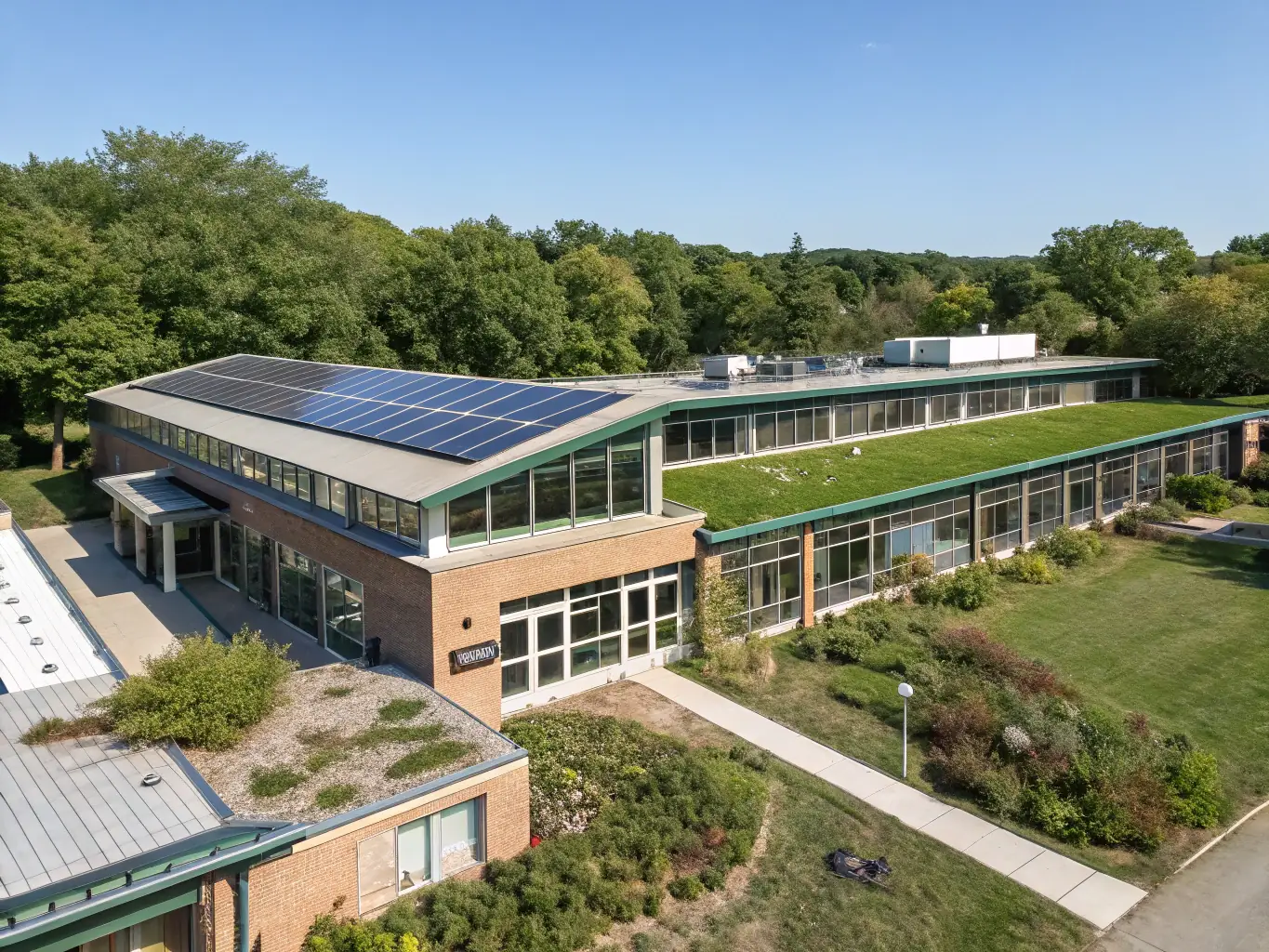 A modern school building with solar panels on the roof, representing sustainable and forward-thinking funding solutions for educational institutions.