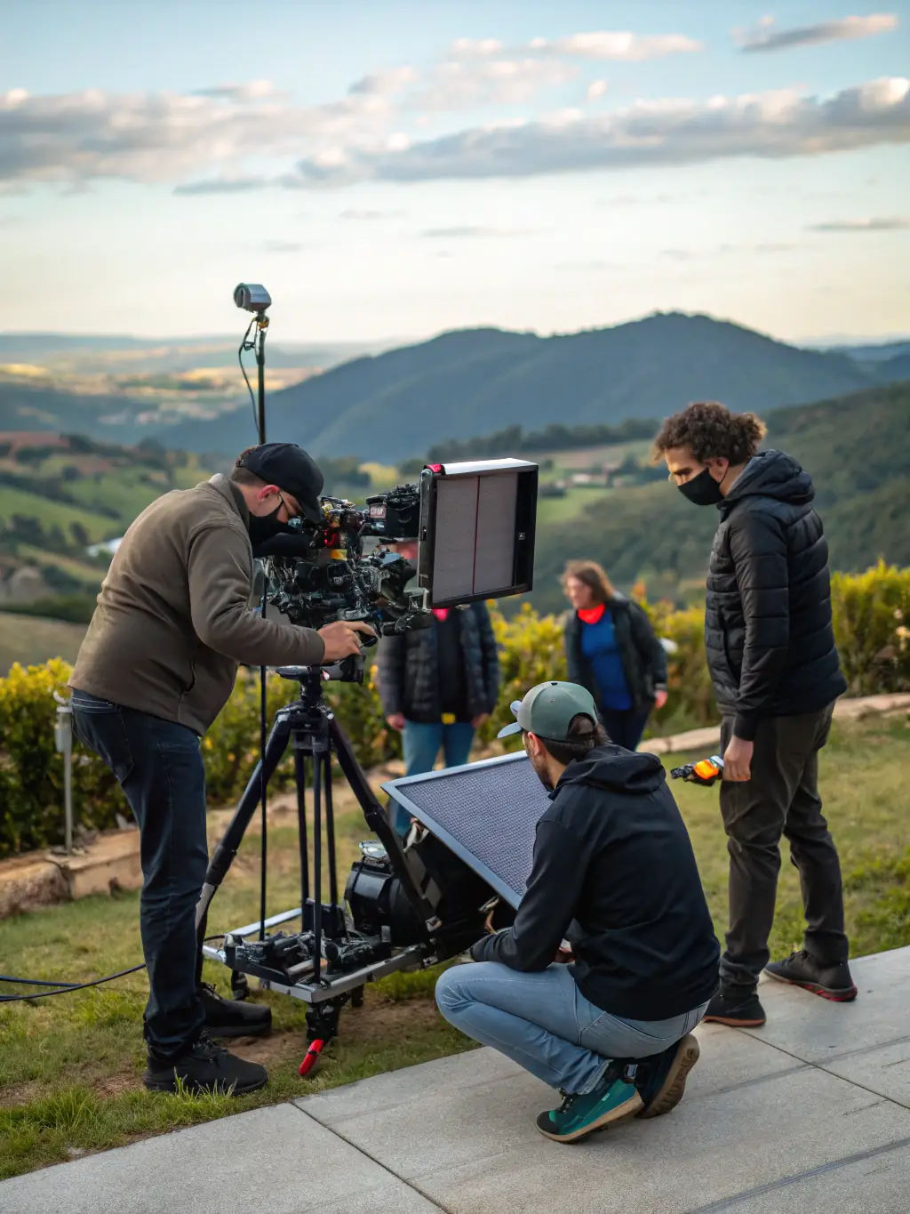 A focused image of a film crew on location, capturing a scene with professional equipment, symbolizing project funding in the media industry.