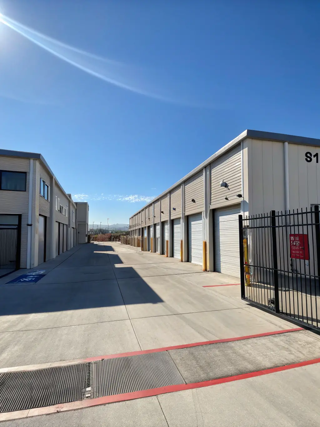 A photograph of various storage facilities, highlighting the diversity of businesses Mulah supports, from small local operations to large warehousing complexes.