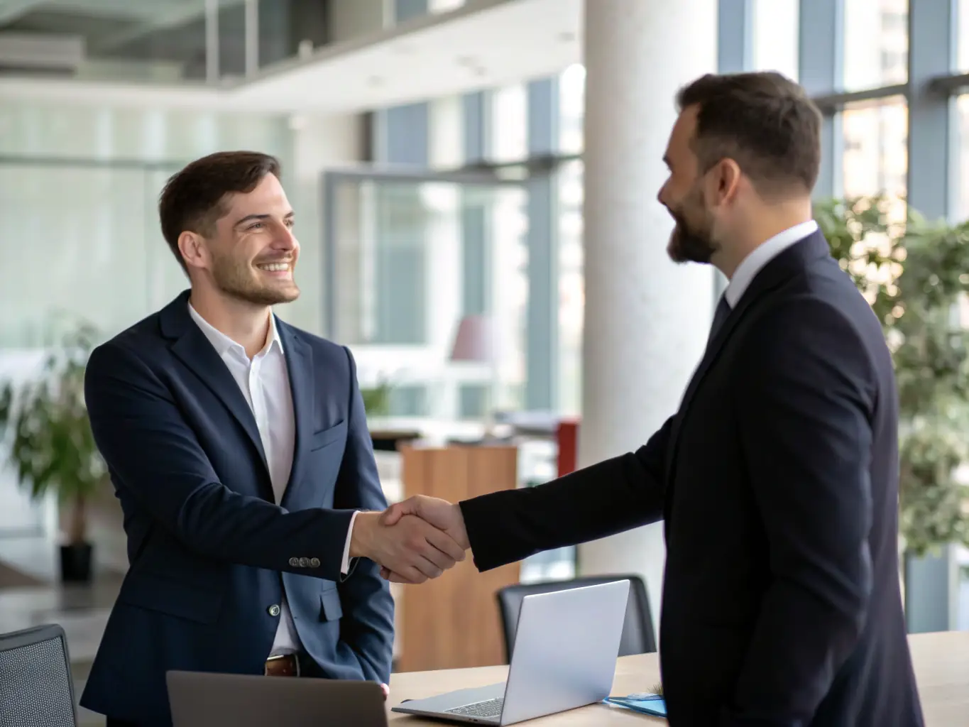 A professional businessman confidently shaking hands with a Mulah representative in a modern office setting, symbolizing a successful partnership and funding agreement.