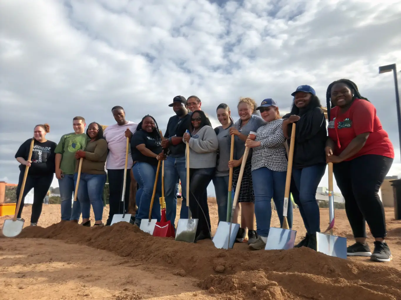 An inspiring image of a new church building being constructed, with a groundbreaking ceremony in progress, symbolizing expansion funding.
